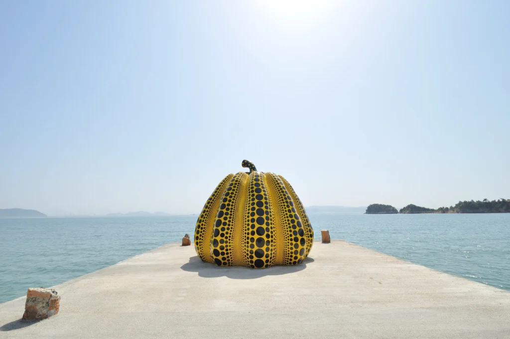 Yayoi Kusama's yellow pumpkin sculpture on the pier at Naoshima