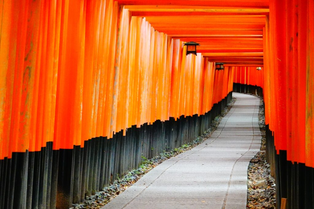The tunnel of closely spaced vermilion torii gates at Fushimi Inari Taisha