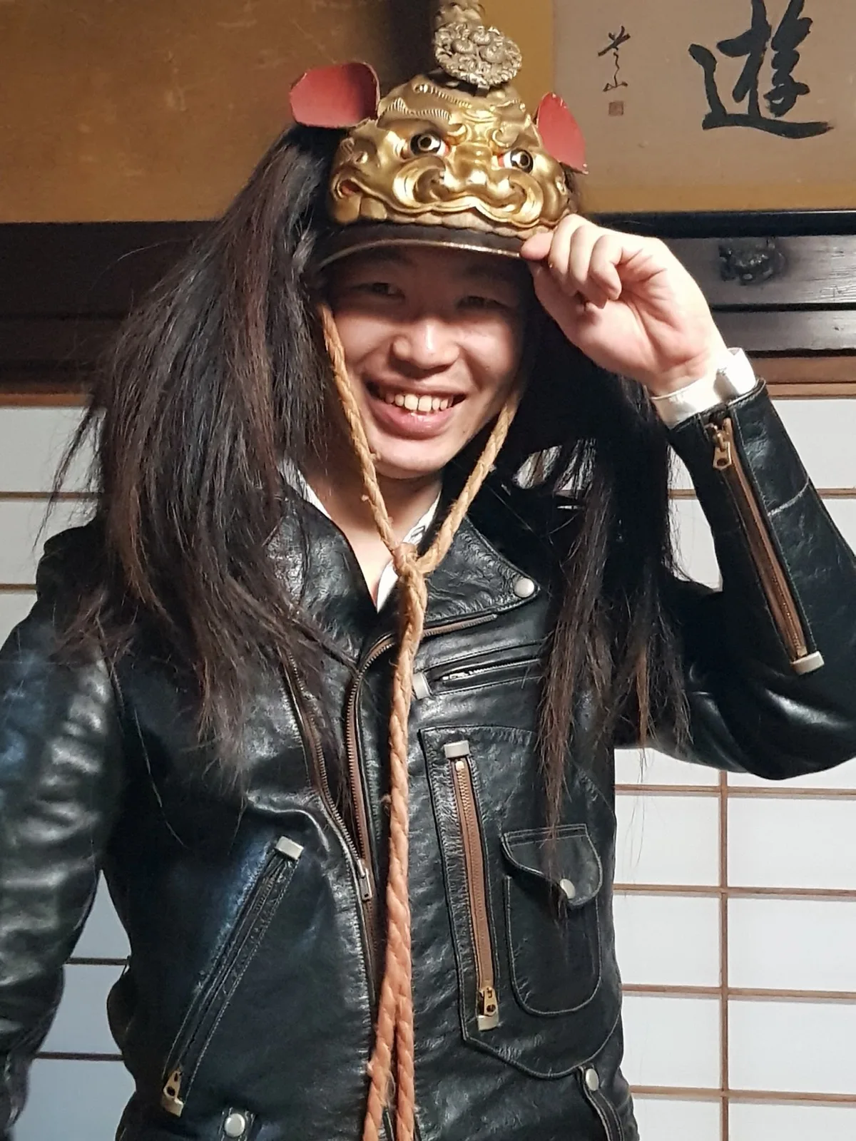 At Manabe House Yutaro Harada tries on a samurai helmet